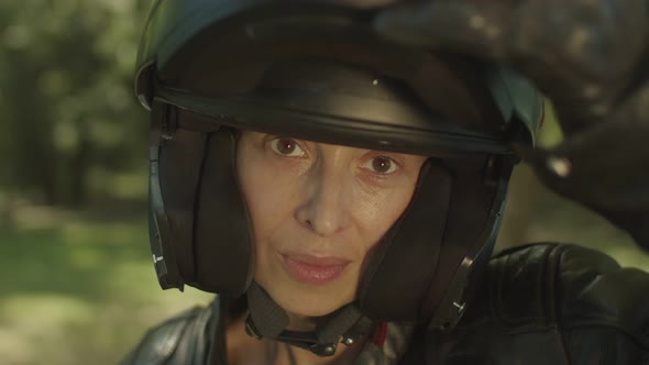 Portrait of Attractive Woman in Motorbike Helmet alt