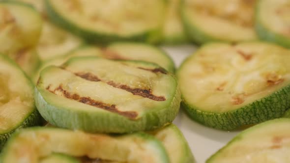 Heat evaporates from zucchini  close-up 4K 2160p 30fps UltraHD footage - Warm Pepo cylindrica slices alt