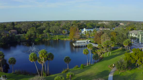 Flying Over a Fountain in a Pond in a Small Town in Florida alt