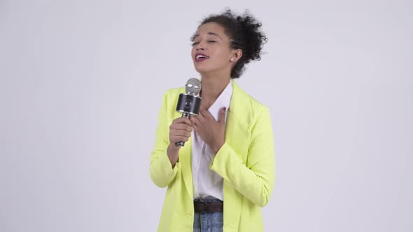 Happy Young Beautiful African Businesswoman Singing with Microphone alt