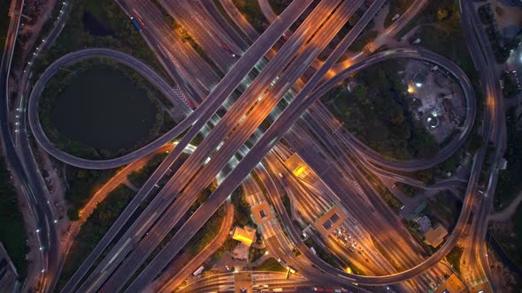 4K UHD : Aerial of drone flight over highway at night rush hour traffic alt