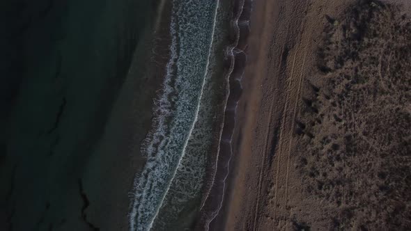 Beautiful Coastline with Waves Shooting From a Bird'seye View By Drone