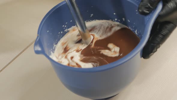 the Pastry Chef Kneads the Cream with the Chocolate Mass with a Blender