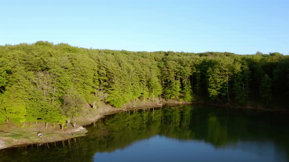 Aerial view of mountain lake at sunset alt