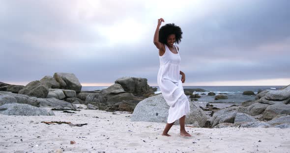 Woman dancing on the beach 