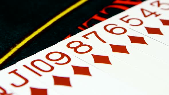 Deck of Cards Laid Out on Casino Table, Close Up alt