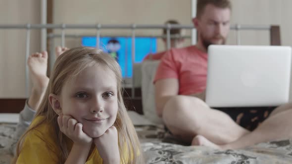 Dad Works Remotely with His Daughter at Home
