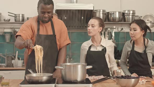 Diverse People Cooking Pasta alt