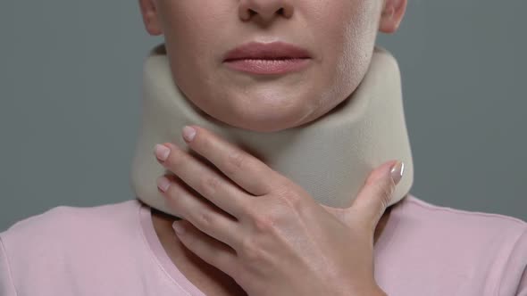 Woman Touching Foam Cervical Collar, Orthopedic Equipment Usage After Trauma