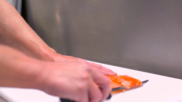 Chef Slicing Smoked Salmon Fish Fillet alt
