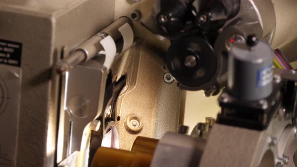 Film Runs Through a 35Mm Projector in a Movie Theater alt