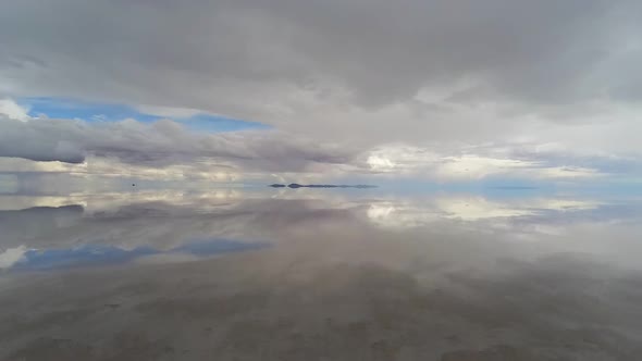 Salar De Uyuni, Bolivia. Aerial View of Endless Horizon and Mirror Reflection on Water alt