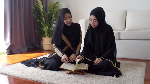 Pretty Muslim women learning about Quran together