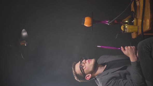 Guy Smokes Hookah alt