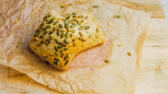 Two Freshly Baked Square Loaves of Bread with Pumpkin Seeds alt