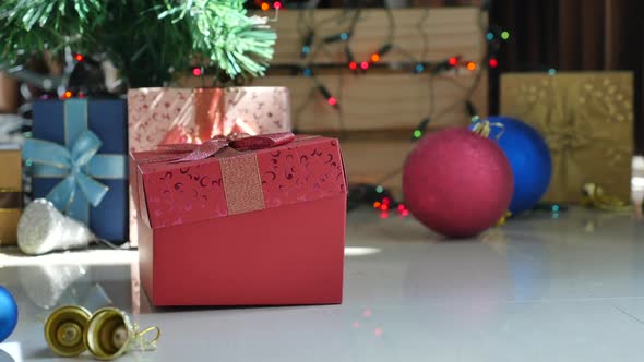 Cute Tabby Kitten Playing In A Gift Box With Christmas Decoration alt