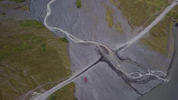 Aerial View of Glacier River and Road in Iceland alt