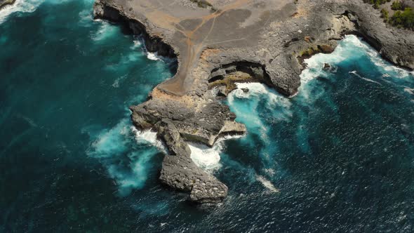 Aerial Drone Flight Over Waves Near Cliff Bali Indonesia alt