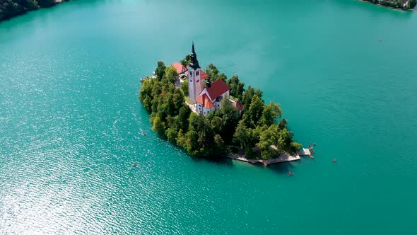 Cinematic view of Lake Bled Island with church alt