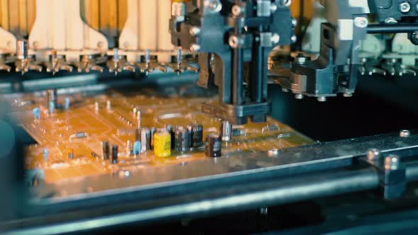 Factory Automation: Pick-and-Place Machine Installing Components on Printed Circuit Boards - 4K alt