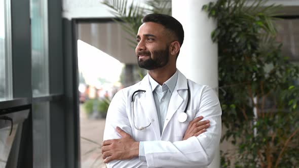 Handsome Smart Proud Indian Professional Therapist in Medical Uniform and Stethoscope Standing in alt