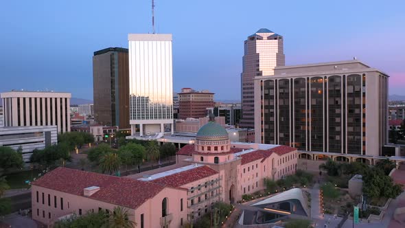 Old Pima County Courthouse in Tucson Arizona. Reflection of sunset in glass windows of high-rises. D alt
