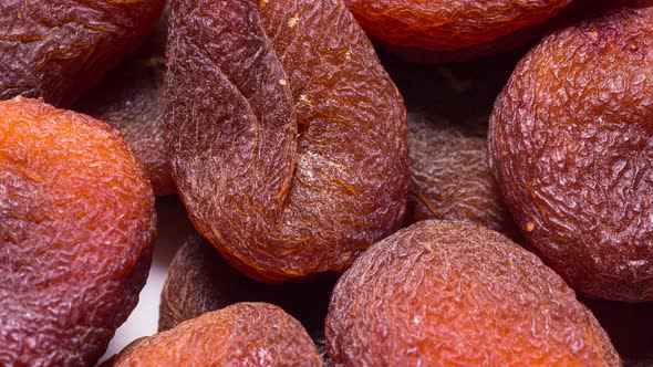 Animated stop motion texture Sun dried brown apricots, traditional  fruit.