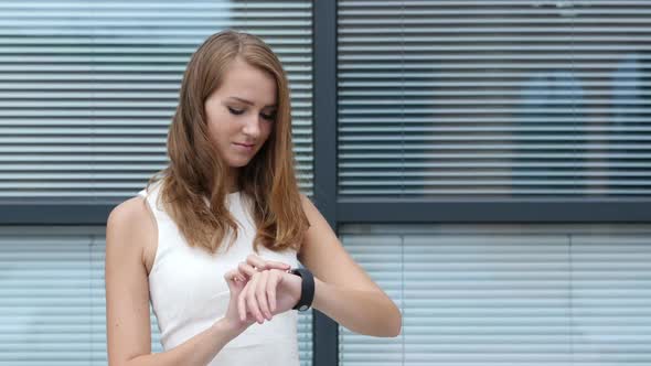 Using Smartwatch by Beautiful Girl, Outside Office alt