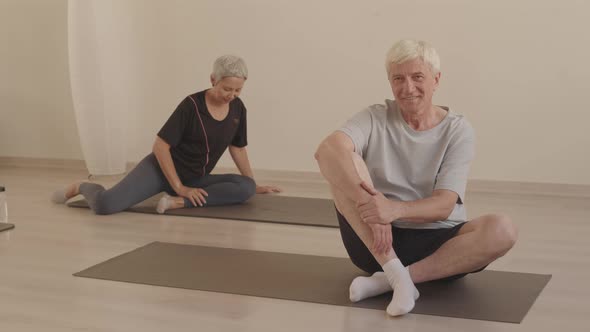 Portrait of Senior Man at Yoga Class alt