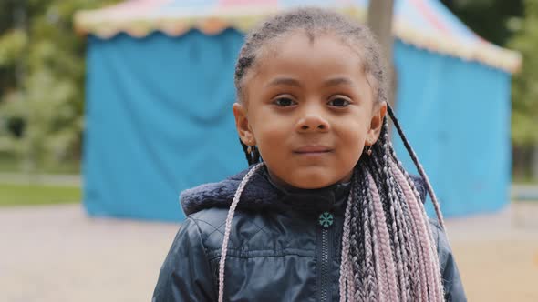 Close Up Multiracial Child Face Calm Friendly Little Girl Looking at Camera Portrait Cute Baby with alt