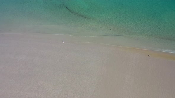 Pretty Lady Walking on Lonely Sandy Beach During Self Isolation Restrictions Due To Covid-19 alt