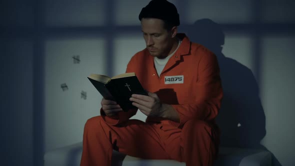 Imprisoned Religious Male Reading Bible, Convicting in Sins, Feeling Guilty alt