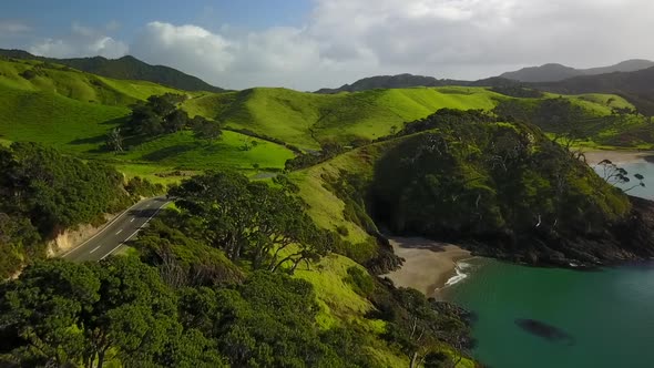 Aerial footage of scenic coastal road on New Zealand coast