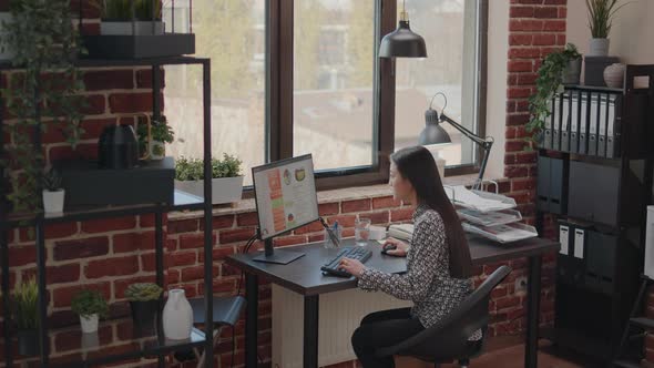 Satisfied Woman Celebrating Business Achievement on Computer alt