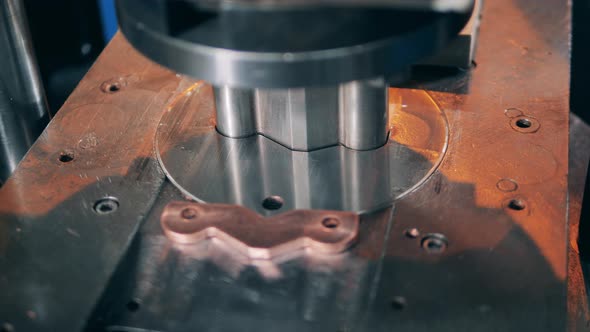 Conveyor Machine is Carving Out Small Copper Elements alt