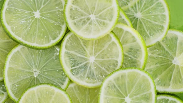 Green Limes Rotating Top View Fresh and Ripe Citrus Fruits Circles alt