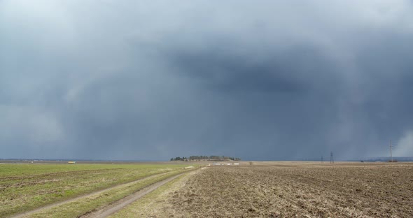 Accumulation Of Snow Clouds Over The Field alt