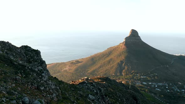 Aerial Shot of Lion's Head Mountain at Sunset with the Ocean in the Background