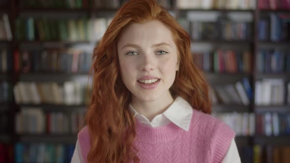 Happy Positive Woman Laughing at Funny Joke Looking at Camera in Library alt