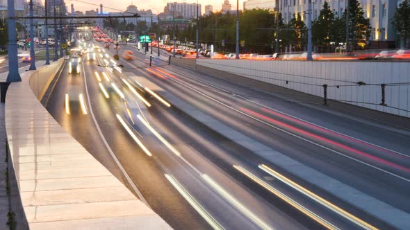 Large Number of Cars Drive Along City Road Timelapse alt