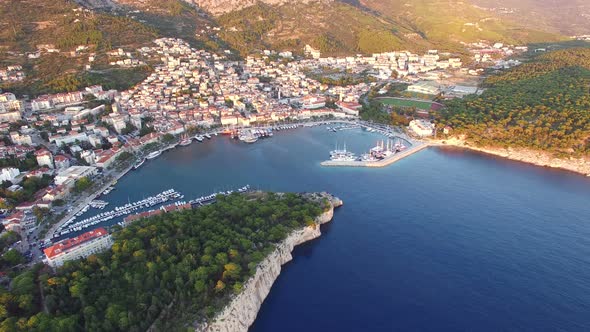 Aerial view of dalmatian bay with houses and football stadium alt