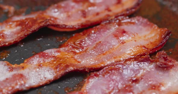 Cook with bacon on fry pan  alt