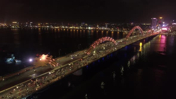 Aerial view of Dragon bridge in Da Nang at night alt
