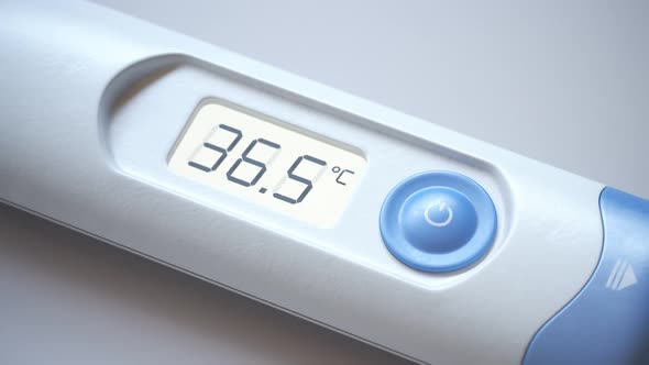 Closeup view at a thermometer with rising temperature value. Fever, flu. 4KHD alt