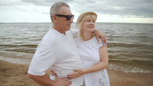 Elderly Married Couple on Seaside Weekend Together alt