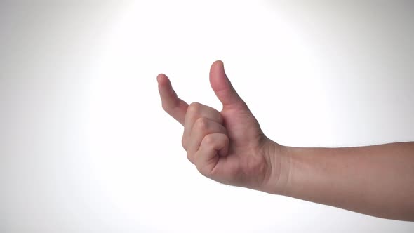 A Man's Hand Shows the Size of His Fingers  Pushes and Narrows the Thumb and Index Finger