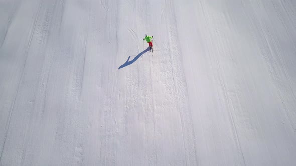 Aerial Top View Following Skier on Piste