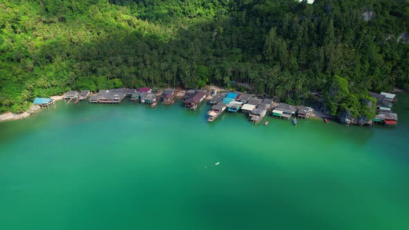 Aerial shot of local fisherman village beside the sea alt