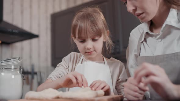 Mom And Daughter Baking Together alt