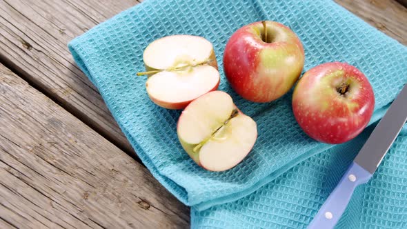 Red apples and knife on napkin alt